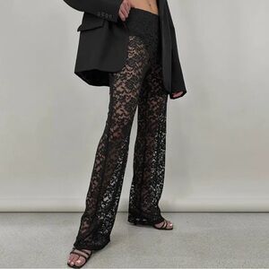 Black lace pants with elastic waist and built in lining.  NWT